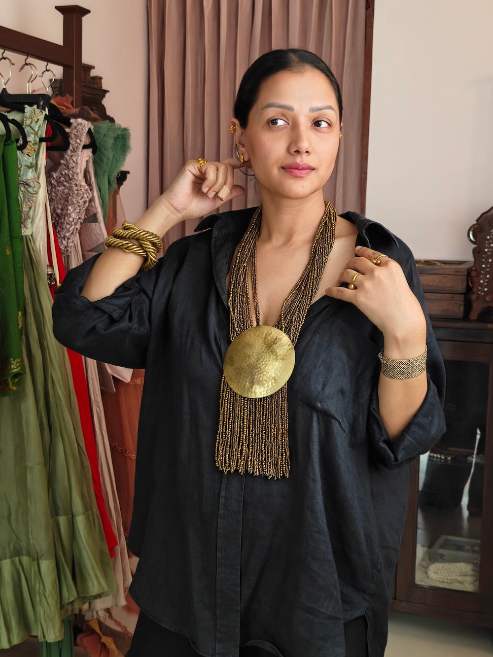 Golden necklace with golden pendant